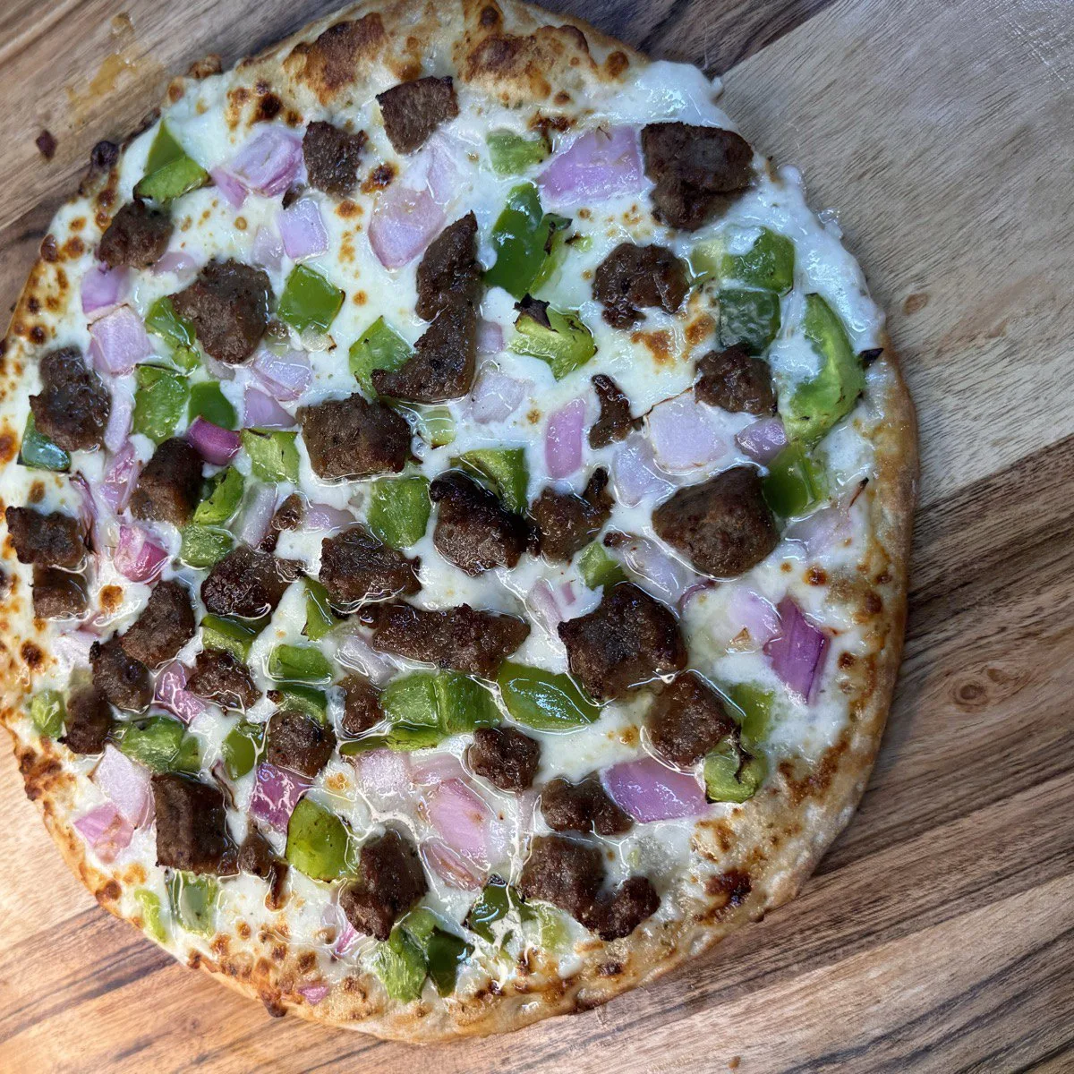 Lamb Pizza topped with halal lamb meat, onions and green peppers, cooked fresh on Valley Street